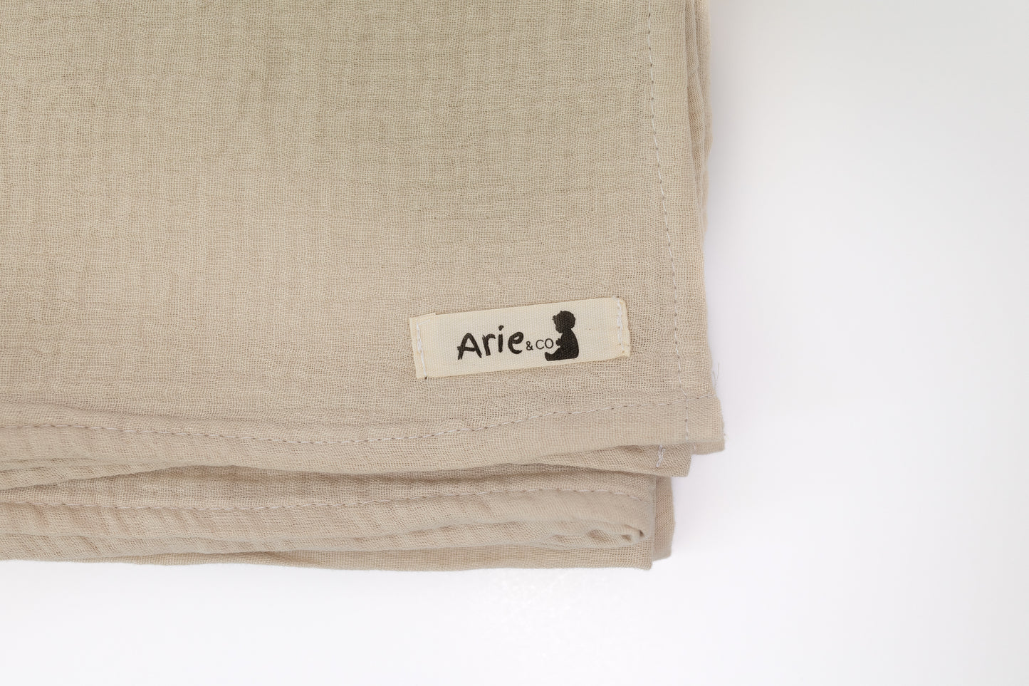 LIGHT TAN MUSLIN SWADDLE